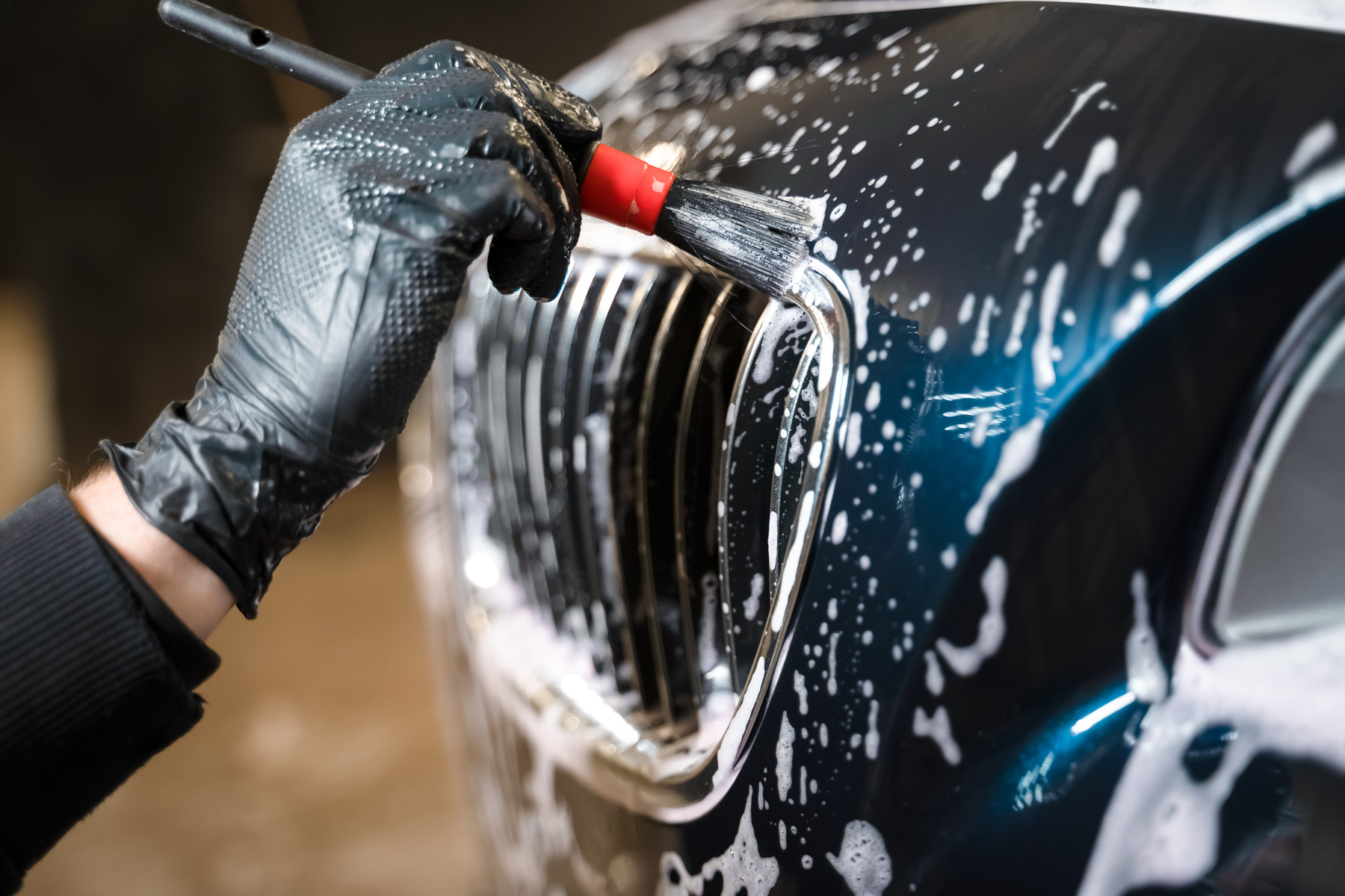 Person Washing Side of Car 